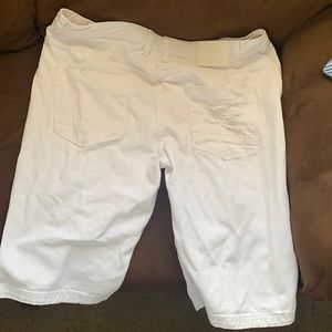White ripped shorts